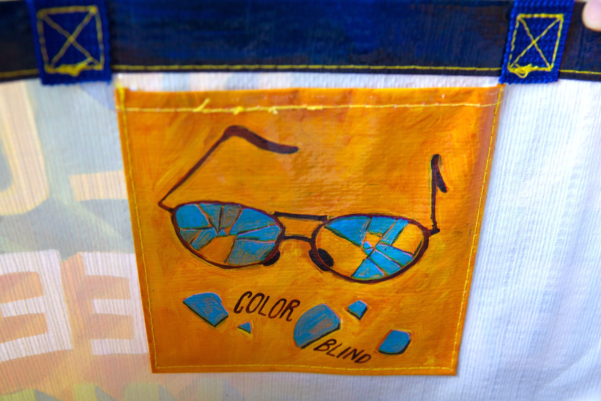 A painting of a pair of glasses with the words 