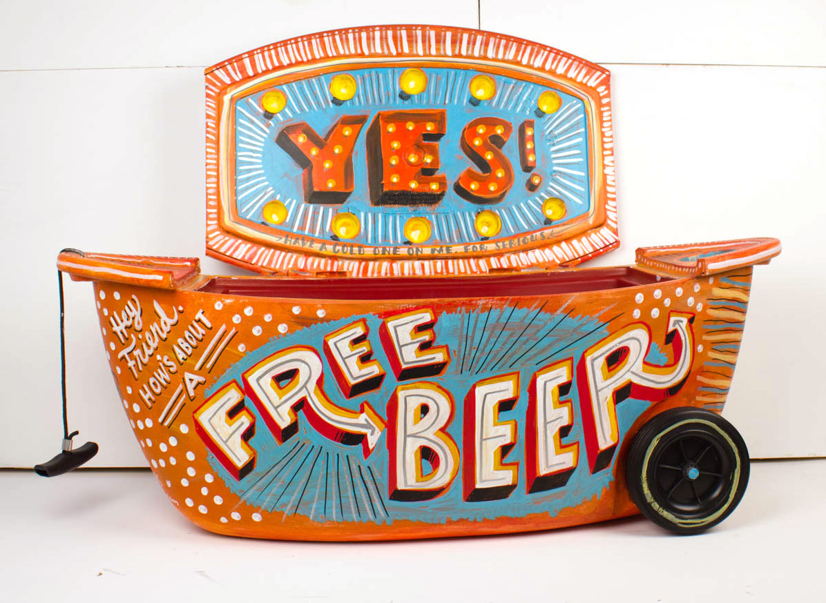 A picture of a free beer sign and camera.