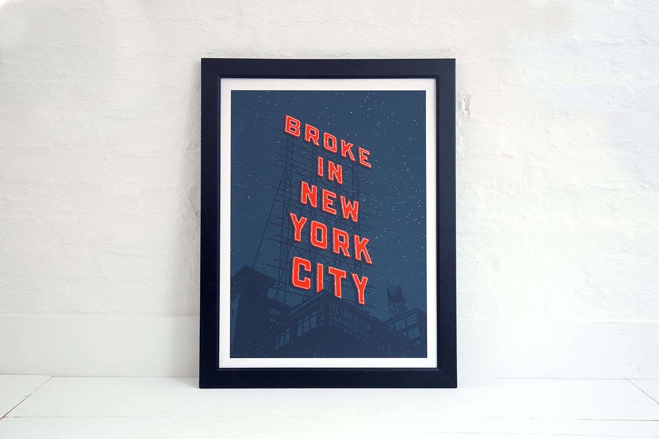 A framed picture of the words broke in new york city.