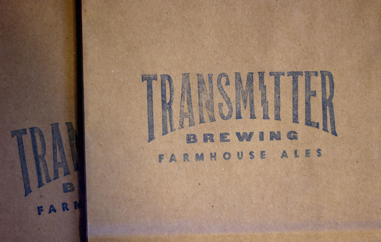 A box that says transmitted brewing farmhouse ale.
